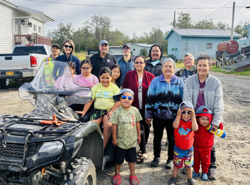 Group in front of blue building
